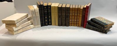 a lot of books that are stacked up on a table