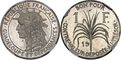 a silver coin with the image of a woman in a headdress and a palm tree
