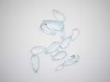 several pieces of clear glass sitting on top of a white surface
