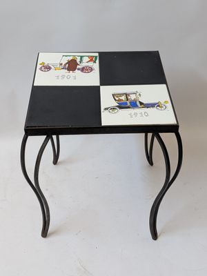 a small table with a black and white design on it