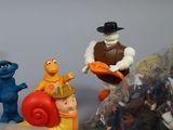 a bunch of toy figurines that are sitting on a table