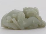 a picture of a white sculpture of a man and a woman