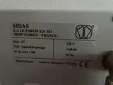 a label on the side of a machine that is on the wall