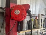 a red fire hydrant on a shelf in a garage