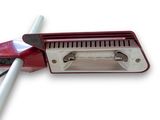 a red and white mop with a handle on a white surface