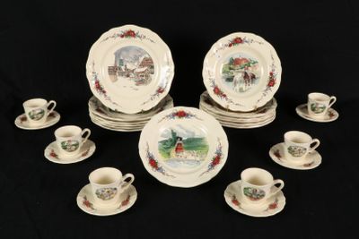 a lot of plates and cups on a black table