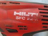 an image of a close up of a red drill on a table