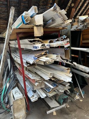 a large pile of metal and wood in a garage