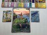 pokemon trading card game on a table with a lot of cards on it