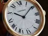 a close up of a watch with roman numerals on it