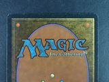 a close up of a magic the gathering card on a table