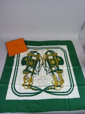 green and white scarf with a pair of shoes on it