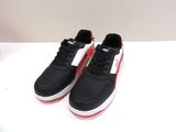 black and red puma sneakers with white soles on a white surface