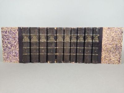 six books are lined up in a row on a table