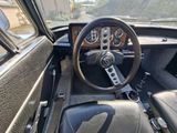a steering wheel and dashboard of an old car