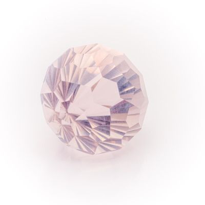 a close up of a pink diamond on a white background