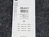 an image of a price tag on a sweater