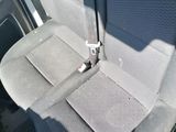 a seat in the back of a car with a seat belt
