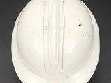 an image of a white helmet on a black surface