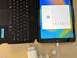 two laptops and a tablet on a table
