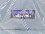 a hat that has a patagonia sticker on it