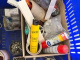 a blue basket filled with assorted items in it