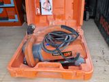 an orange tool box with a cord and a tool in it