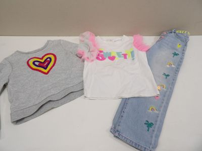 three pieces of clothing that are on a table