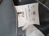 a label on the back of a jacket with a picture of a horse on it