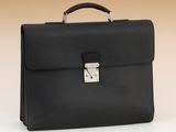 a black briefcase sitting on top of a white table