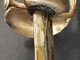 a sword that is on display on a table