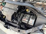 a picture of a car engine with its hood open