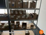 boxes of food are stacked on a shelf in a warehouse