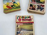 three comics are stacked on top of each other on a table
