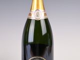 an image of a bottle of champagne sitting on a table