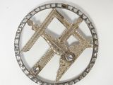 a picture of a metal object on a white surface