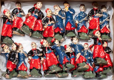 many figurines of people in a box on a table