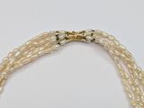 three strand pearl necklace with gold tone clasp