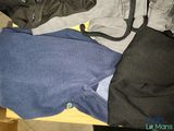 a pile of clothes that is sitting on a table