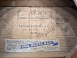 a label on a piece of wood that says paul heuscher