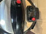 a close up of an electric skillet on a table