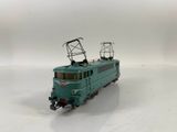 a toy train on a white surface with a white background
