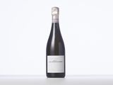a bottle of wine that is sitting on a table