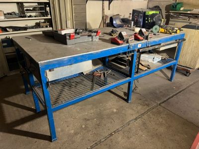 a workbench with tools on it in a garage