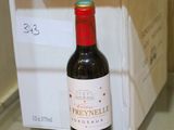 a bottle of wine sitting on a counter next to a box