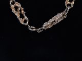 a close up of a necklace on a mannequin mannequin mannequin mannequin mannequin mannequin mannequin mannequin