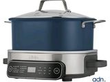 a large blue pot sitting on top of a stainless steel stove