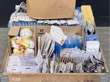 a wooden box filled with assorted items on top of a pallet