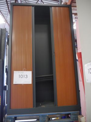 two wooden cabinets in a warehouse with a price tag on them