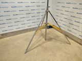 an image of a tripod in front of a wall